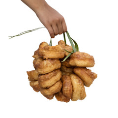 Hand holding fresh baked Moroccan donuts
