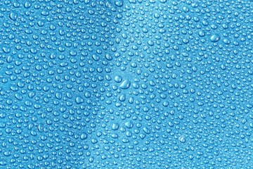 closeup drops water on blue background