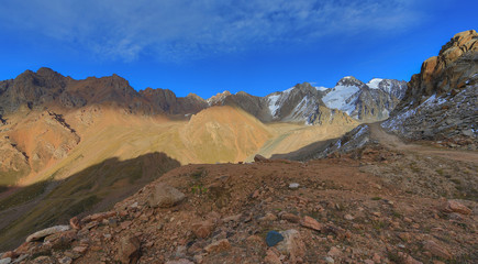 Obraz premium cirque glaciers, rocky road, red mountain stone, summer, glacial valleys, mountains, Kazakhstan, Kyrgyzstan