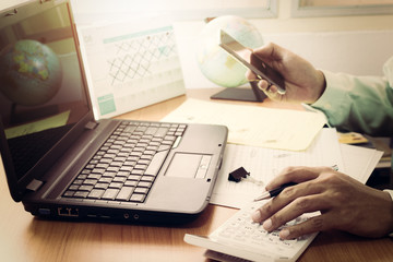 Man working on office desk in vintage tone