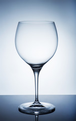 An empty wine glass on a white background