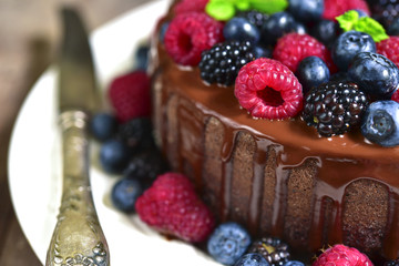 Chocolate cake with fresh forest berries.