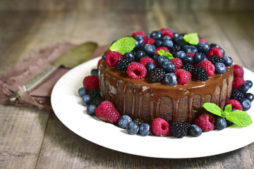 Chocolate cake with fresh forest berries.