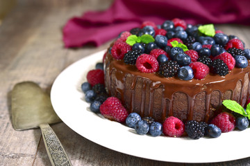 Chocolate cake with fresh forest berries.