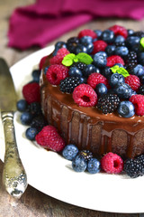 Chocolate cake with fresh forest berries.