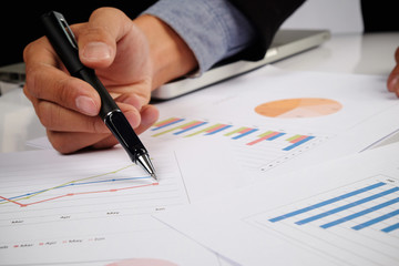 Business man hand pointing at business document during discussio