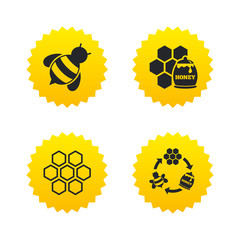 Honey icon. Honeycomb cells with bees symbol. © blankstock