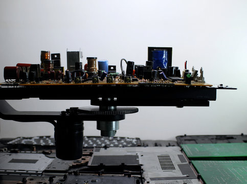 Soldered radio components on printed electronic board side view