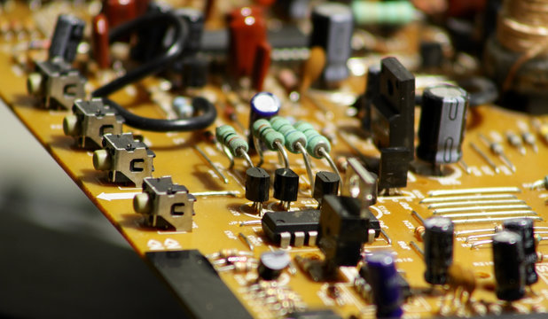 Printed electronic board with soldered radio components macro shot stock image
