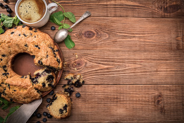 Blueberry cake with cup of coffee. Background.