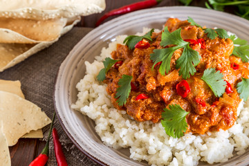 Chicken curry with rice and cilantro.
