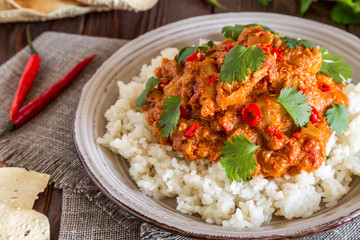 Chicken curry with rice and cilantro.