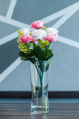 Colorful rose in vase.