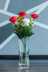 Colorful rose in vase.