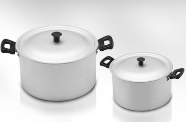 several cooking pots on a light background