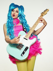 Obraz premium The girl in anime-style guitar playing.