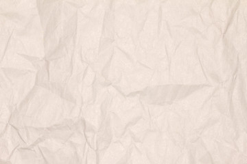 Recycled crumpled light brown paper texture or paper background for design with copy space for text or image.