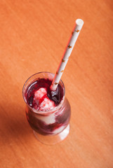 pink cocktail with red plum and yoghurt,