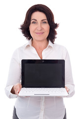 portrait of beautiful mature business woman showing laptop with