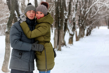 Fototapeta premium young lovers walk smile winter
