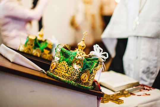 Two beautiful wedding crowns in church