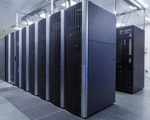 room with rows of server hardware in the data center