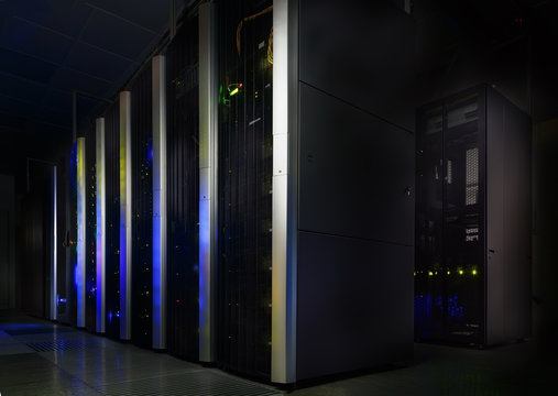 server room in dark, with bright colored lights motion