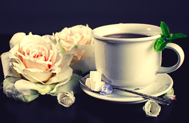 Beautiful roses in a cup