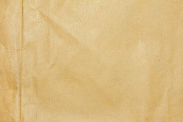 Recycled crumpled brown paper texture or paper background for design with copy space for text or image.