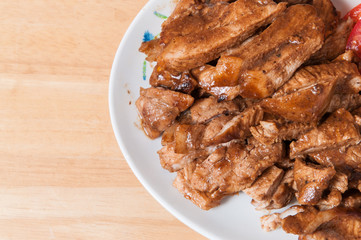 Pork slices in a dish on the table.