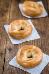 Bagels on a wooden table (close-up shot)