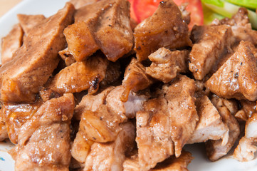 Pork slices in a dish on the table.
