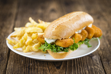 Roll with fried Fish Sticks (close-up shot)