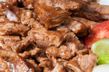 Pork slices in a dish on the table.