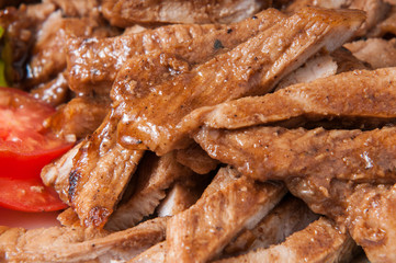 Pork slices in a dish on the table.