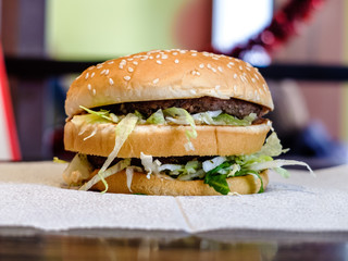 Double Burger with - unhealthy eating fast food. High-calorie foods promotes obesity.