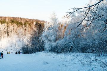 Panorama of the ski resort. Winter landscape. Snowboarders downhill.
