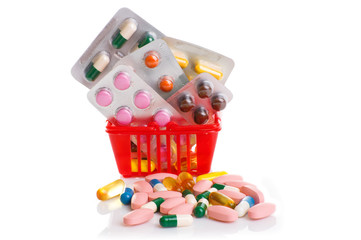 Shopping trolley with pills and medicine isolated on white