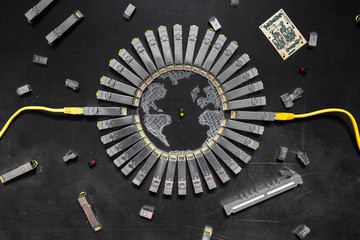 Electrical Internet SFP network modules as the shape of Earth, network switch, RJ45 ethernet cables, RJ45 connectors, circuit board   with microchips, diodes are on the black background