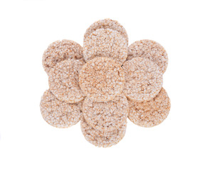 Brown organic rice cakes separated on white background