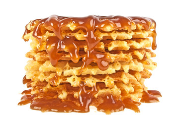 Waffles with caramel topping isolated on a white background