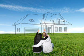 People are dreaming about a new home. Drawn house on the meadow