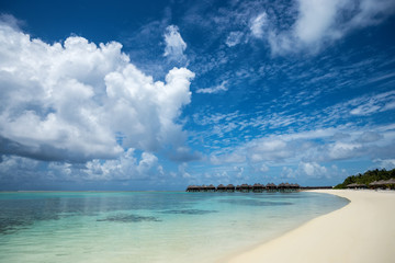 Beautiful beach with water bungalows at Maldives