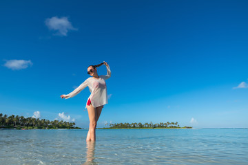 Beach vacation. Hot beautiful woman enjoying looking view of bea