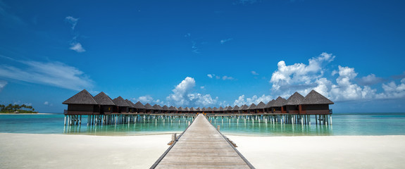 Beautiful beach with water bungalows at Maldives