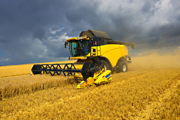 Combine Harvester Cutting Barley, Approaching Thunderstorm