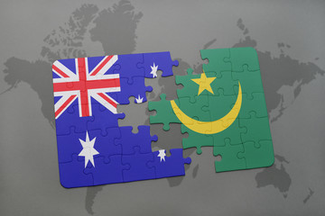puzzle with the national flag of australia and mauritania on a world map background.