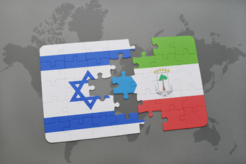 Fototapeta premium puzzle with the national flag of israel and equatorial guinea on a world map background.