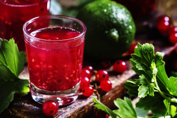 Lime lemonade with mashed red currants, selective focus