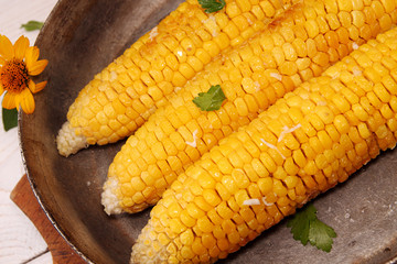 Corn baked in oven with butter and garlic